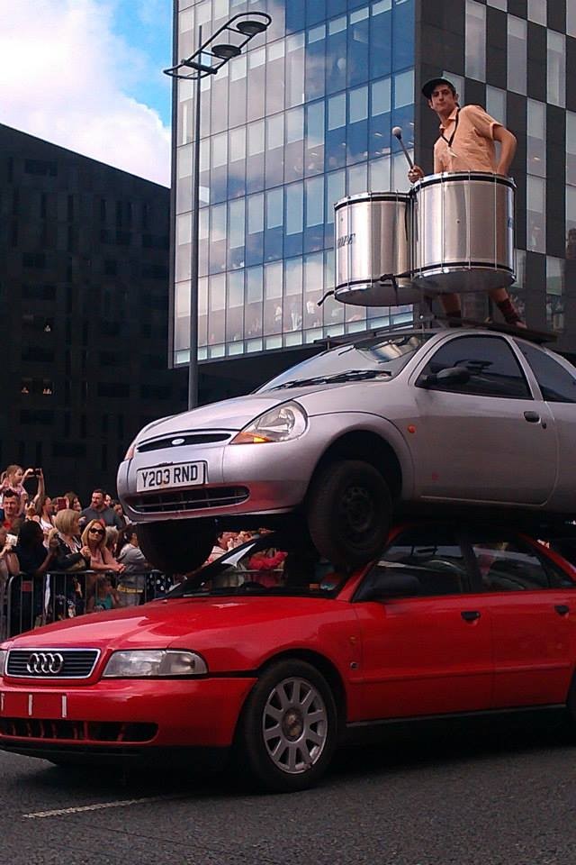 Away from the Kazimier, Rob Lewis can be found drumming atop of two cars while trailing Giants around Liverpool